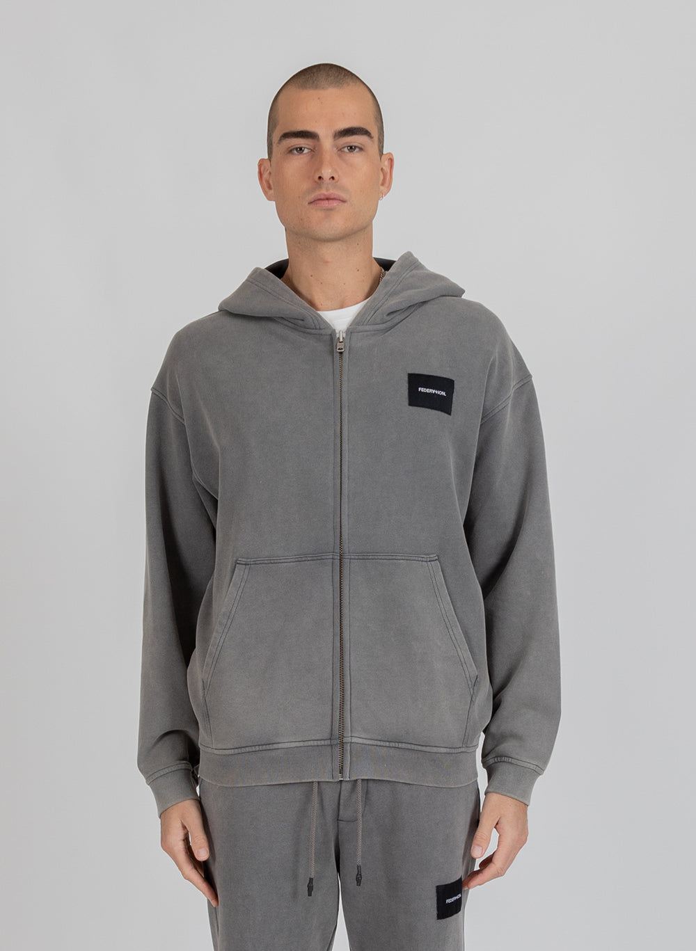 Axel Zip Up - Woven Badge