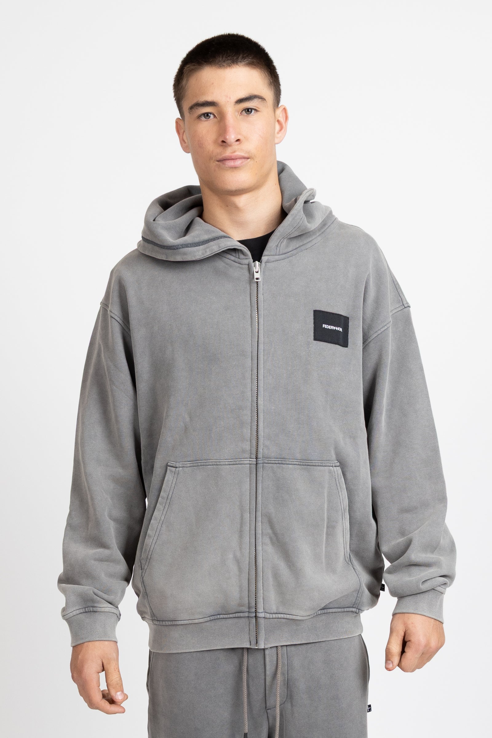 Axel Zip Up - Woven Badge